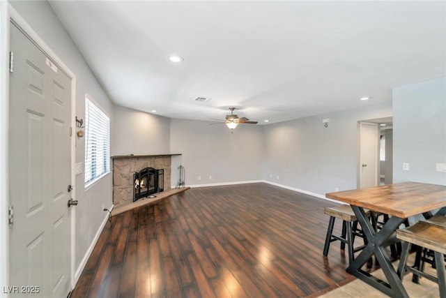 2708 Beaver Creek Ct Unit 202, Las Vegas, NV 89117 - unfurnished living room featuring a ceiling fan, recessed lighting, baseboards, wood finished floors, and a fireplace
