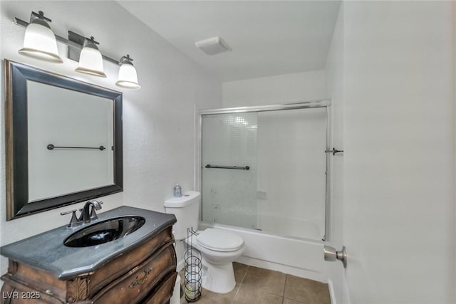 2708 Beaver Creek Ct Unit 202, Las Vegas, NV 89117 - bathroom featuring toilet, tile patterned floors, vanity, and shower / bath combination with glass door