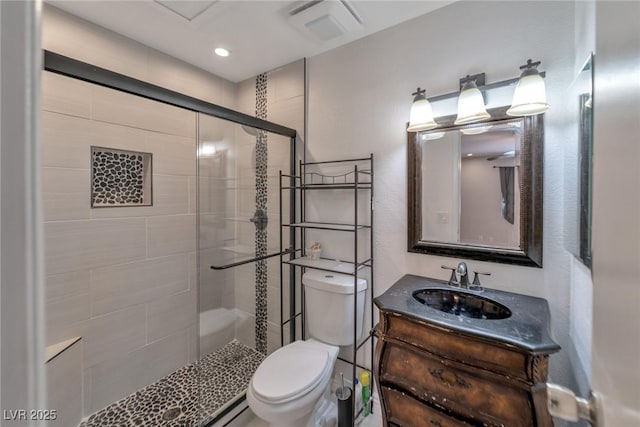 2708 Beaver Creek Ct Unit 202, Las Vegas, NV 89117 - bathroom with toilet, a stall shower, vanity, and recessed lighting