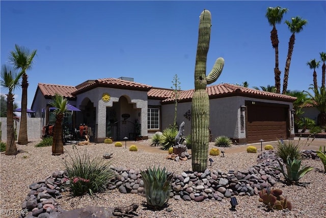 444 Viewmont Dr, Henderson, NV 89015 - mediterranean / spanish-style house with stucco siding, a garage, a tiled roof, and driveway