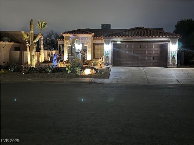 444 Viewmont Dr, Henderson, NV 89015 - mediterranean / spanish home featuring concrete driveway, a garage, a tile roof, and stucco siding
