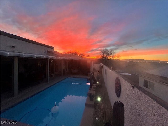 444 Viewmont Dr, Henderson, NV 89015 - pool at dusk with a patio