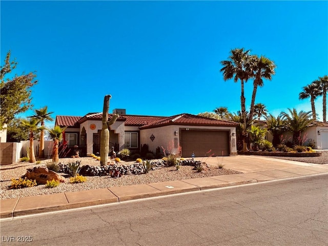 444 Viewmont Dr, Henderson, NV 89015 - mediterranean / spanish-style house with stucco siding, an attached garage, a tile roof, and driveway