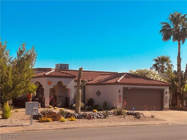 444 Viewmont Dr, Henderson, NV 89015 - view of front of property with driveway, a garage, a tiled roof, and stucco siding