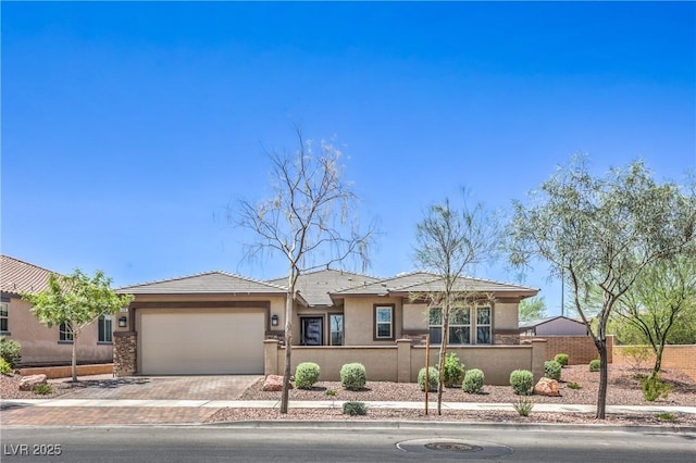 508 Cadence View Way, Henderson, NV 89011 - prairie-style house with stucco siding, a garage, decorative driveway, and a tile roof