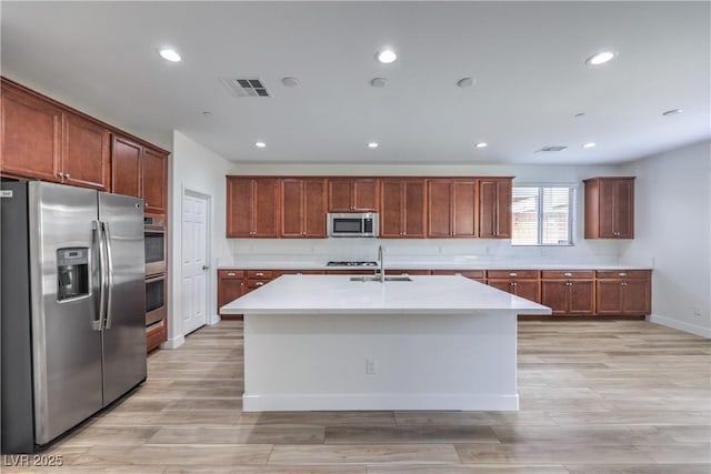 508 Cadence View Way, Henderson, NV 89011 - kitchen with appliances with stainless steel finishes, a sink, light countertops, light wood finished floors, and recessed lighting