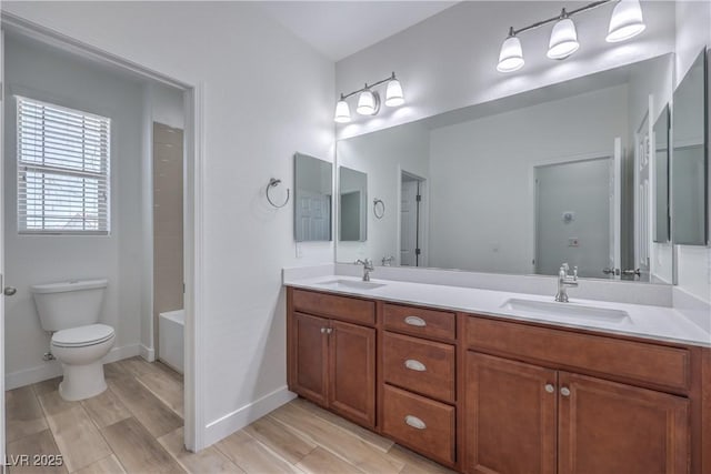 508 Cadence View Way, Henderson, NV 89011 - full bathroom featuring double vanity, toilet, wood finished floors, and baseboards