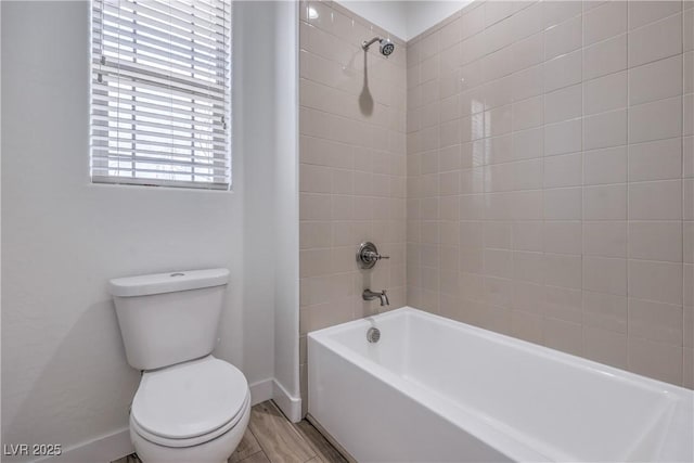 508 Cadence View Way, Henderson, NV 89011 - bathroom featuring toilet, baseboards, shower / bathtub combination, and wood finished floors