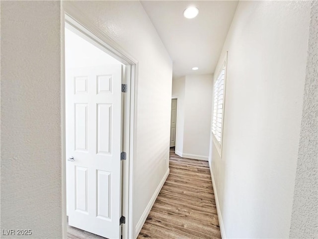 3829 N Mayfield Ranch Rd, Pahrump, NV 89060 - hall with wood finished floors, baseboards, and recessed lighting