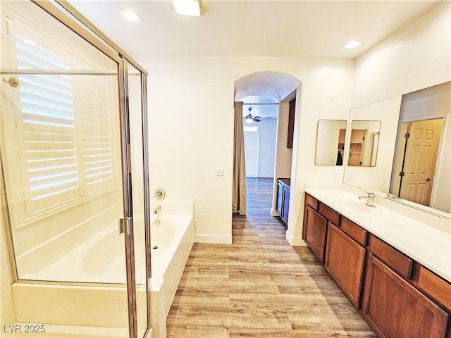 3829 N Mayfield Ranch Rd, Pahrump, NV 89060 - bathroom with a garden tub, vanity, wood finished floors, a shower stall, and recessed lighting
