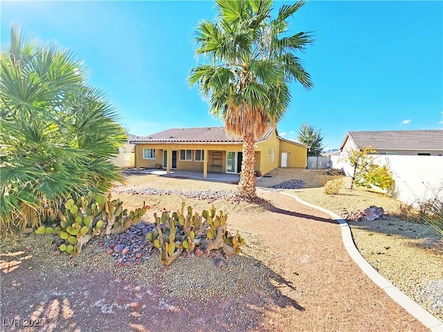 3829 N Mayfield Ranch Rd, Pahrump, NV 89060 - back of property featuring stucco siding, a patio, and a tile roof