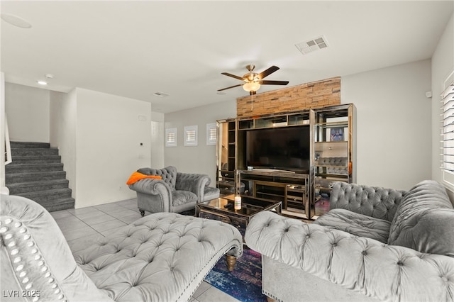 9161 Rolling Sky Dr, Las Vegas, NV 89178 - tiled living room featuring ceiling fan, stairway, and healthy amount of natural light