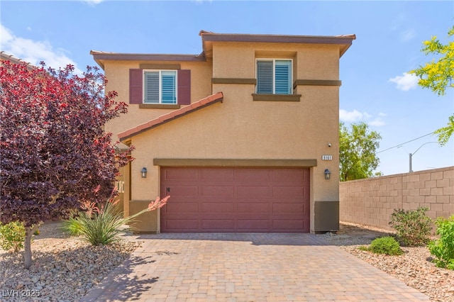 9161 Rolling Sky Dr, Las Vegas, NV 89178 - view of front facade with stucco siding, decorative driveway, and a garage