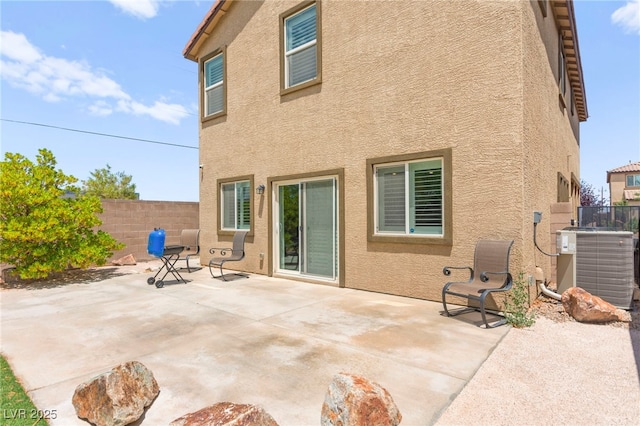 9161 Rolling Sky Dr, Las Vegas, NV 89178 - back of house featuring cooling unit, stucco siding, and a patio area