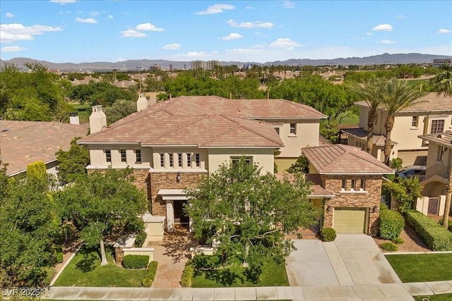 300 N Royal Ascot Dr, Las Vegas, NV 89144 - mediterranean / spanish-style house with stone siding, stucco siding, concrete driveway, an attached garage, and a chimney