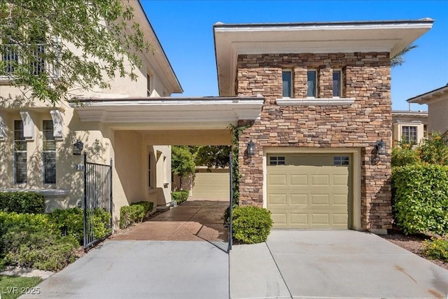300 N Royal Ascot Dr, Las Vegas, NV 89144 - view of front of house featuring driveway, stucco siding, stone siding, and an attached garage