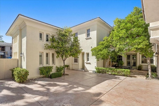 300 N Royal Ascot Dr, Las Vegas, NV 89144 - view of front of home with stucco siding and a patio
