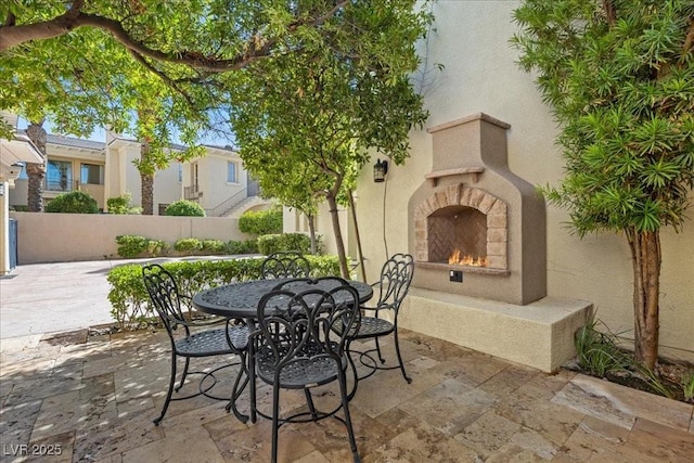 300 N Royal Ascot Dr, Las Vegas, NV 89144 - view of patio / terrace featuring a warm lit fireplace