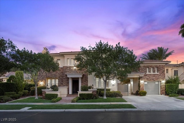 300 N Royal Ascot Dr, Las Vegas, NV 89144 - view of front of home with stone siding, concrete driveway, a garage, and stucco siding