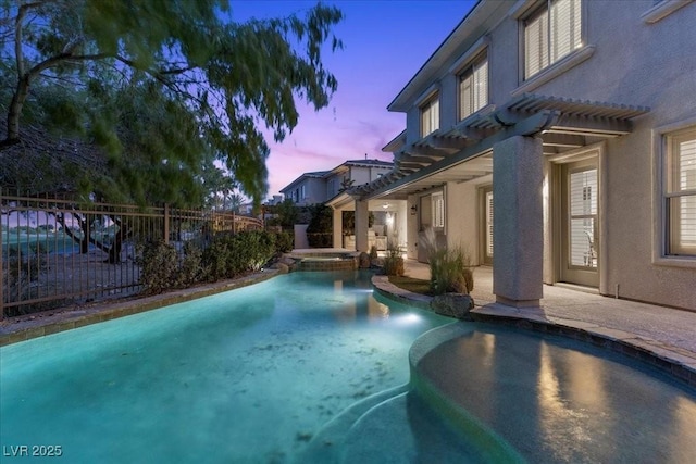 300 N Royal Ascot Dr, Las Vegas, NV 89144 - pool at dusk with a pergola, a pool with connected hot tub, and a patio area