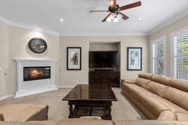 300 N Royal Ascot Dr, Las Vegas, NV 89144 - living room featuring light colored carpet, a ceiling fan, recessed lighting, ornamental molding, and a glass covered fireplace