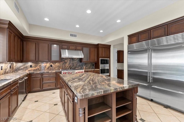 300 N Royal Ascot Dr, Las Vegas, NV 89144 - kitchen with built in appliances, under cabinet range hood, light tile patterned flooring, open shelves, and recessed lighting