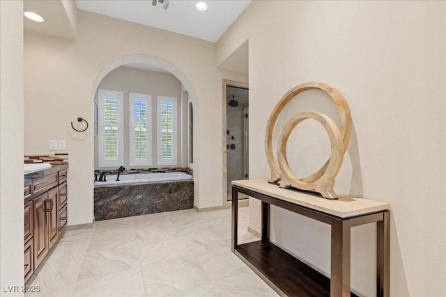 300 N Royal Ascot Dr, Las Vegas, NV 89144 - bathroom with a stall shower, vanity, a garden tub, and recessed lighting