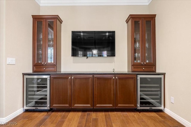 300 N Royal Ascot Dr, Las Vegas, NV 89144 - indoor dry bar with wine cooler, wood finished floors, and crown molding