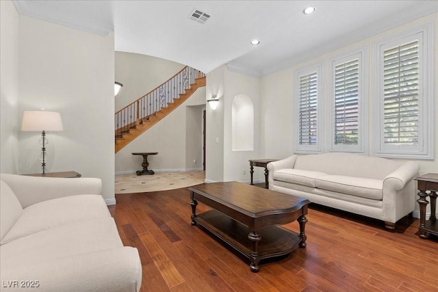 300 N Royal Ascot Dr, Las Vegas, NV 89144 - living area featuring recessed lighting, stairway, wood finished floors, ornamental molding, and arched walkways