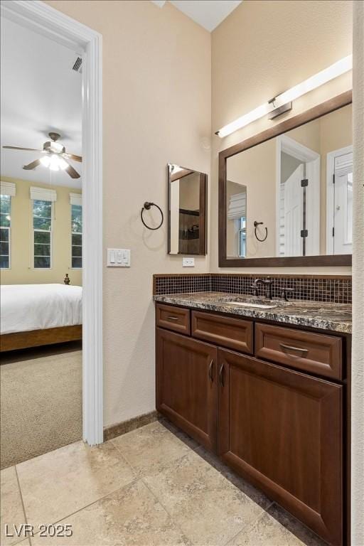 300 N Royal Ascot Dr, Las Vegas, NV 89144 - bathroom featuring vanity, ceiling fan, and connected bathroom