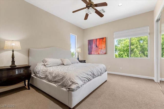 300 N Royal Ascot Dr, Las Vegas, NV 89144 - bedroom featuring multiple windows, light colored carpet, and a ceiling fan