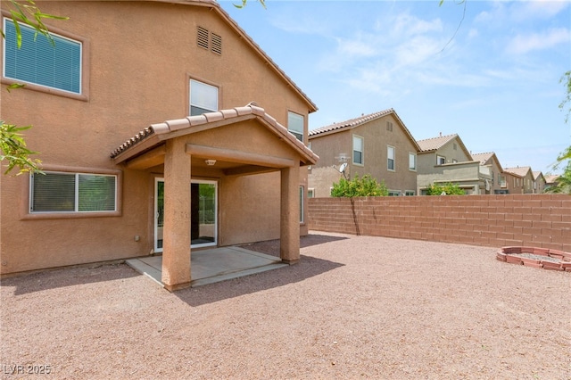 6480 Chebec St, North Las Vegas, NV 89084 - rear view of property featuring stucco siding, a patio, and a fenced backyard