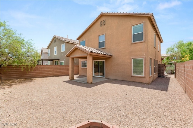 6480 Chebec St, North Las Vegas, NV 89084 - rear view of house with stucco siding, a fenced backyard, and a patio area