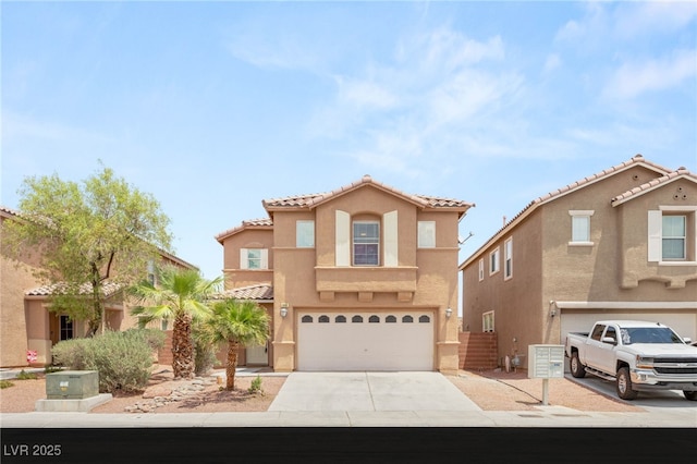 6480 Chebec St, North Las Vegas, NV 89084 - mediterranean / spanish home with a garage, concrete driveway, stucco siding, and a tile roof