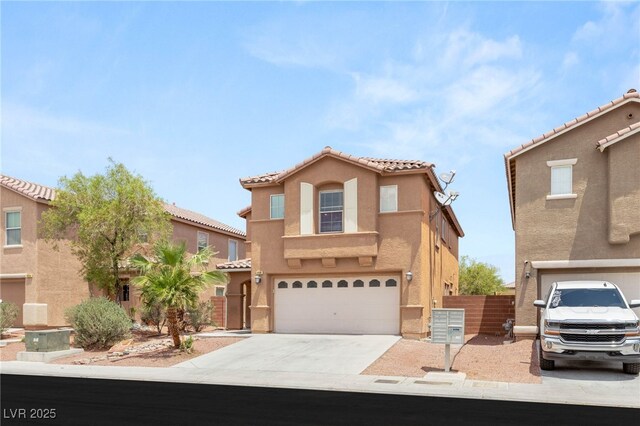 6480 Chebec St, North Las Vegas, NV 89084 - mediterranean / spanish house with a garage, concrete driveway, stucco siding, and a tiled roof