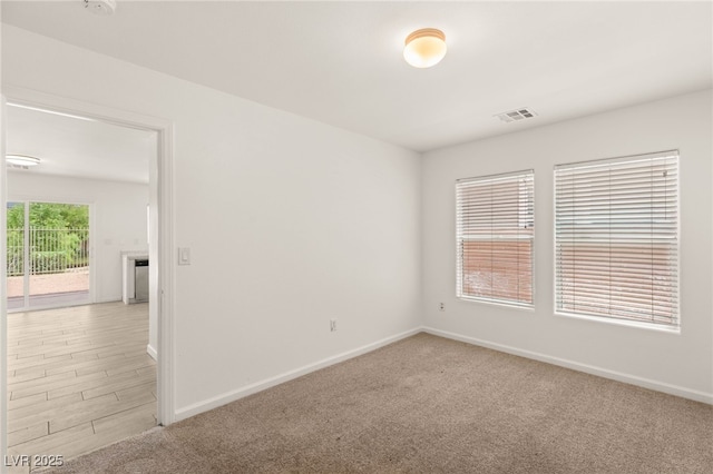 6480 Chebec St, North Las Vegas, NV 89084 - spare room featuring baseboards and light carpet