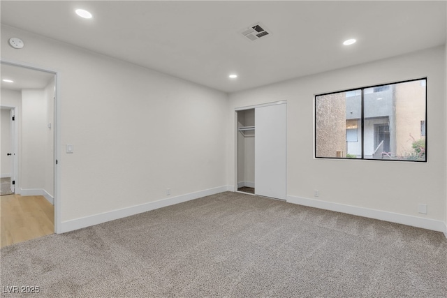 3151 Soaring Gulls Dr Unit 1179, Las Vegas, NV 89128 - unfurnished bedroom with light carpet, recessed lighting, baseboards, and a closet
