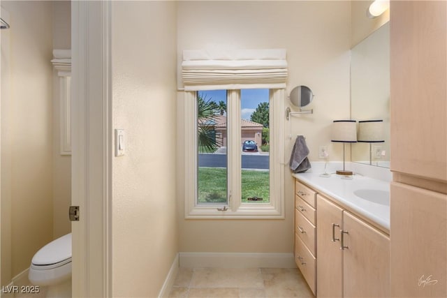 522 Via Ventana Dr, Mesquite, NV 89027 - bathroom featuring vanity, toilet, and baseboards