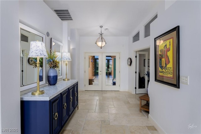 522 Via Ventana Dr, Mesquite, NV 89027 - entrance foyer with stone tile floors, french doors, and baseboards