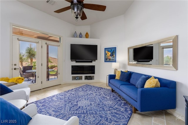 522 Via Ventana Dr, Mesquite, NV 89027 - living room featuring ceiling fan, tile patterned floors, and baseboards