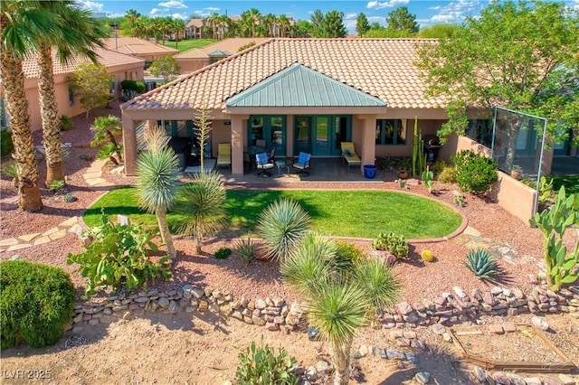 522 Via Ventana Dr, Mesquite, NV 89027 - back of house featuring a tile roof and stucco siding