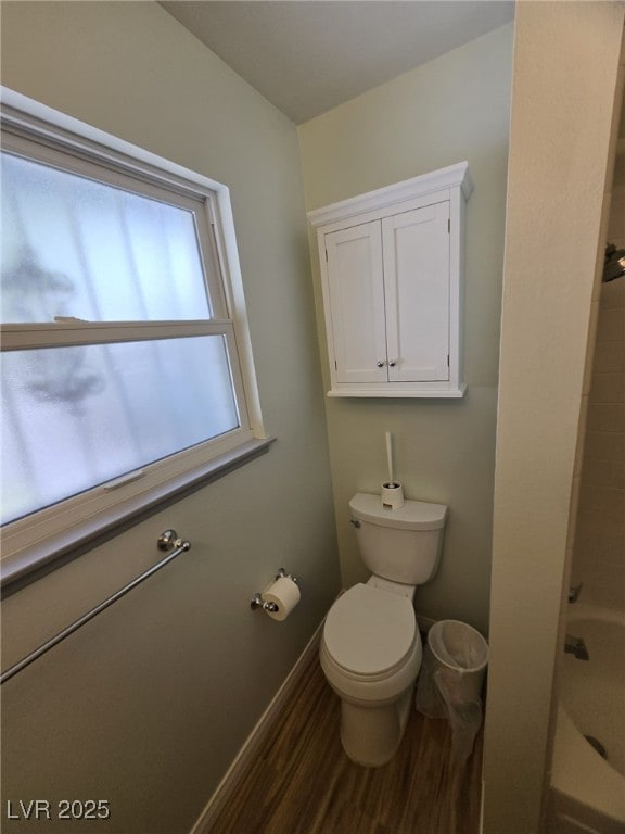 6284 Explorer Dr, Las Vegas, NV 89103 - full bath with baseboards, toilet, and wood finished floors