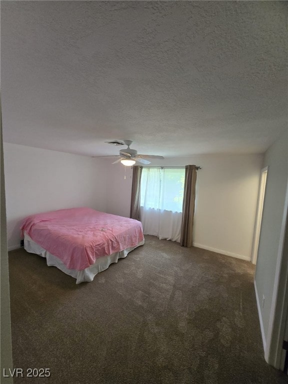 6284 Explorer Dr, Las Vegas, NV 89103 - bedroom with carpet floors, a ceiling fan, a textured ceiling, and baseboards