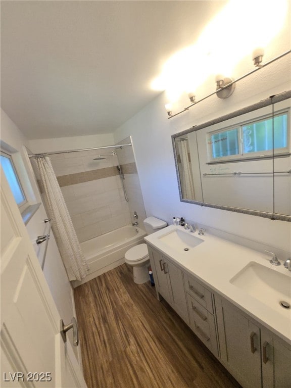 6284 Explorer Dr, Las Vegas, NV 89103 - full bathroom with wood finished floors, shower / bath combo, toilet, and double vanity