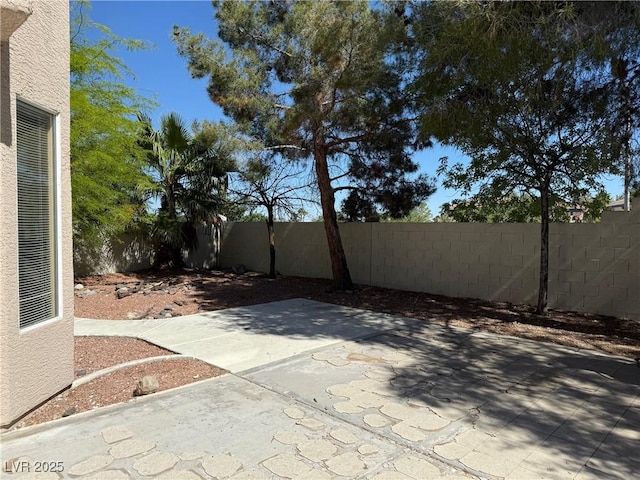 9709 Port Orange Ln, Las Vegas, NV 89134 - fenced backyard featuring a patio area