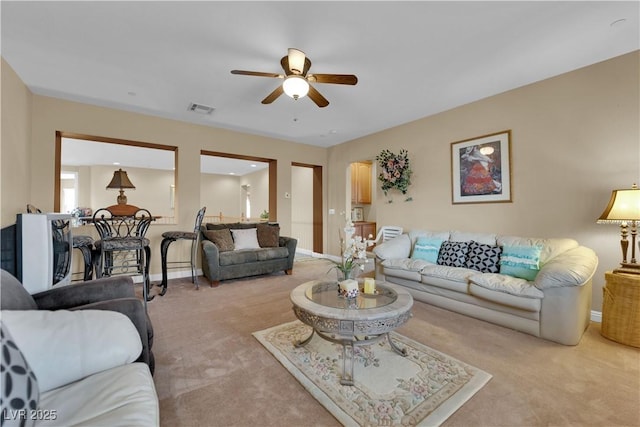 9614 Stonily Ln, Las Vegas, NV 89178 - living room with ceiling fan, light carpet, and baseboards