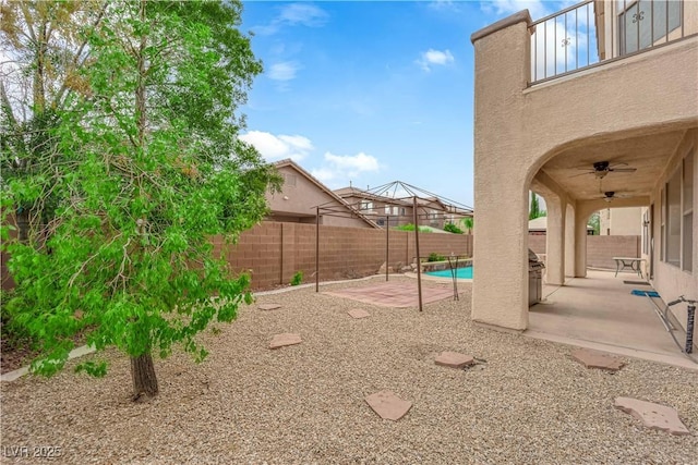 9614 Stonily Ln, Las Vegas, NV 89178 - fenced backyard with a patio area and a ceiling fan