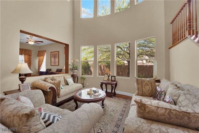 9614 Stonily Ln, Las Vegas, NV 89178 - living area featuring plenty of natural light, a towering ceiling, wood finished floors, and ceiling fan