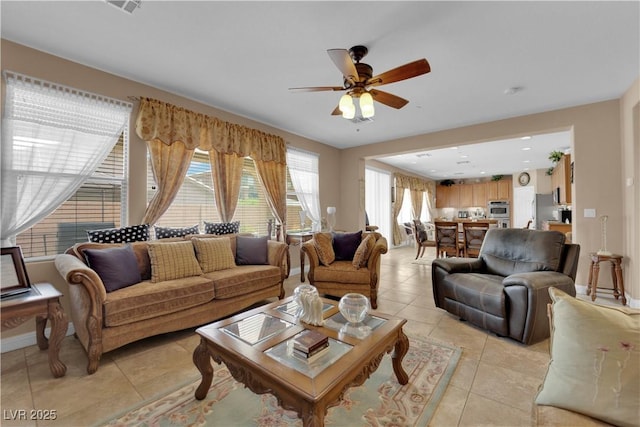 9614 Stonily Ln, Las Vegas, NV 89178 - living room featuring light tile patterned flooring, a ceiling fan, and baseboards