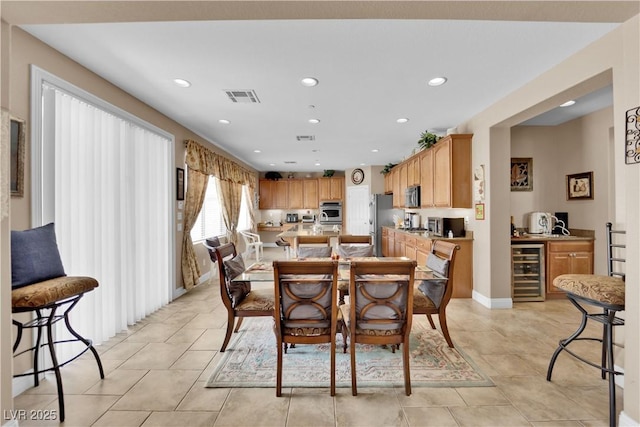 9614 Stonily Ln, Las Vegas, NV 89178 - dining room with beverage cooler, recessed lighting, light tile patterned floors, and bar